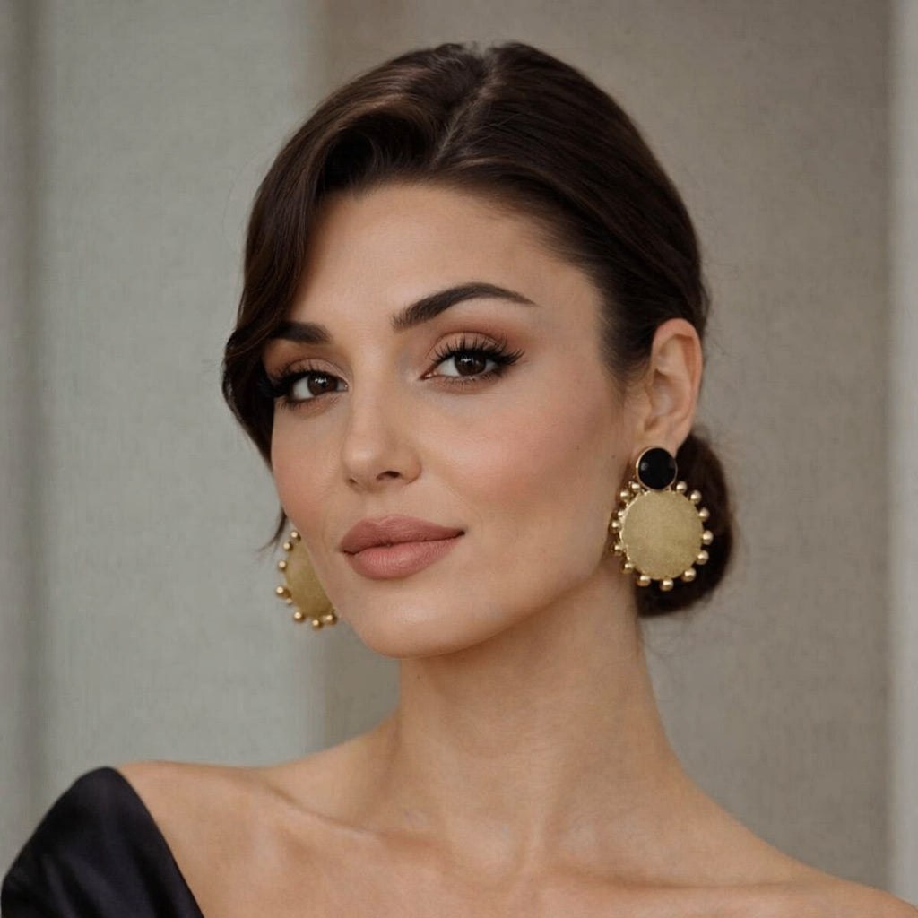 black with round gold earring