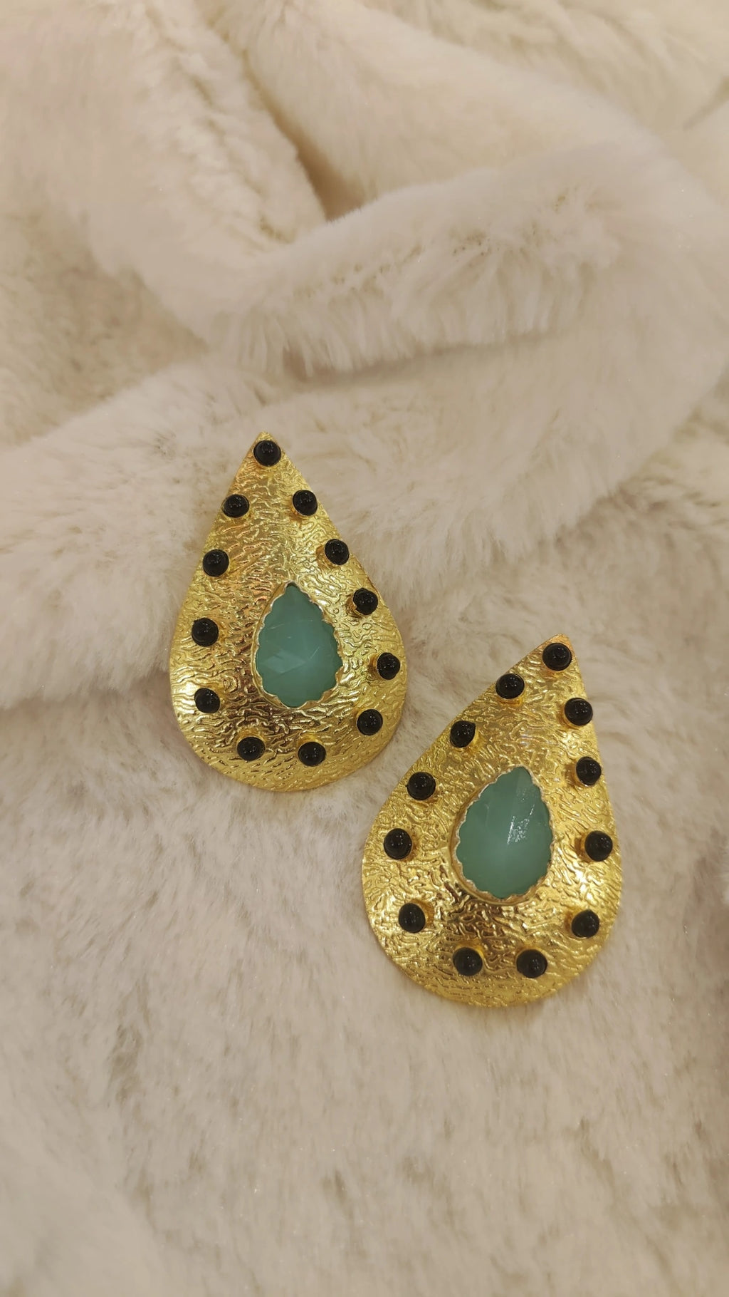 gold with black and green stone earring