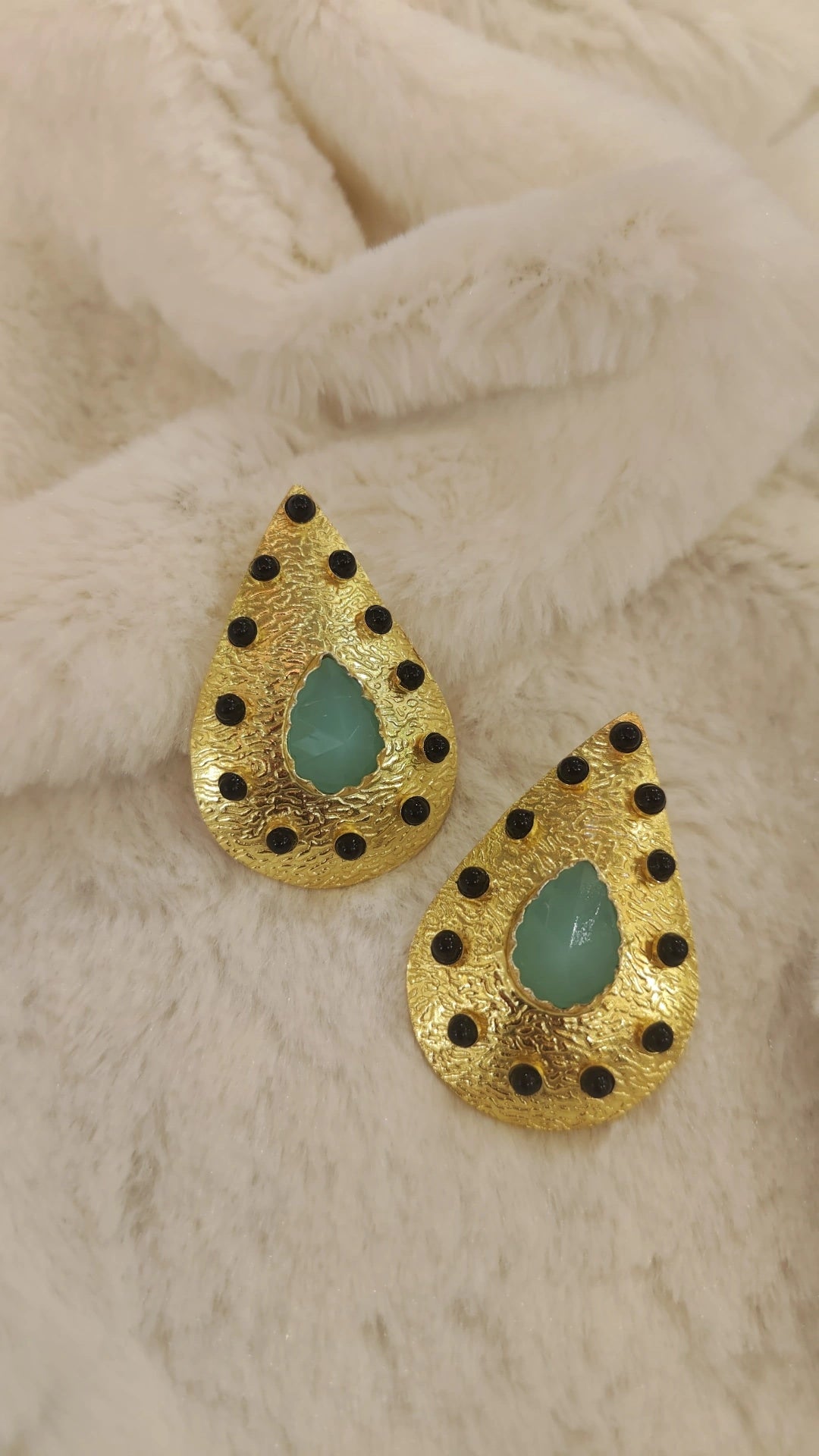 gold with black and green stone earring
